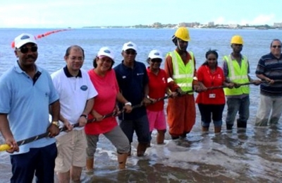 Minister Sinon leading the way in laying fibre optic cables in May 2012 (photo Nation.sc)